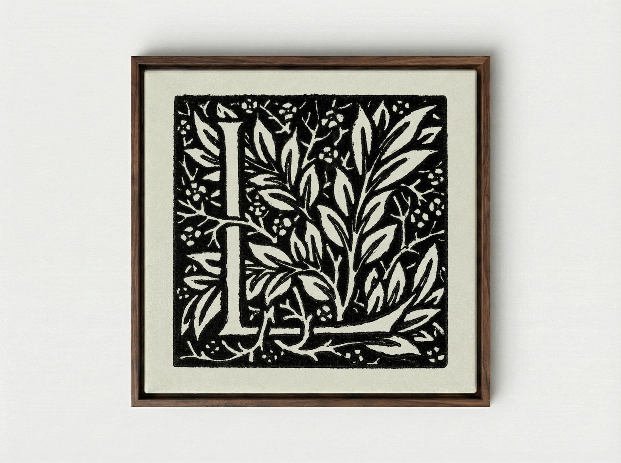 Love is Enough: Initial Letter 'L' entwined with Laurel Leaves - William Morris - Framed Canvas Dark Wood