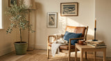 A Japandi-style interior with a single piece of Japanese-influenced wall art.