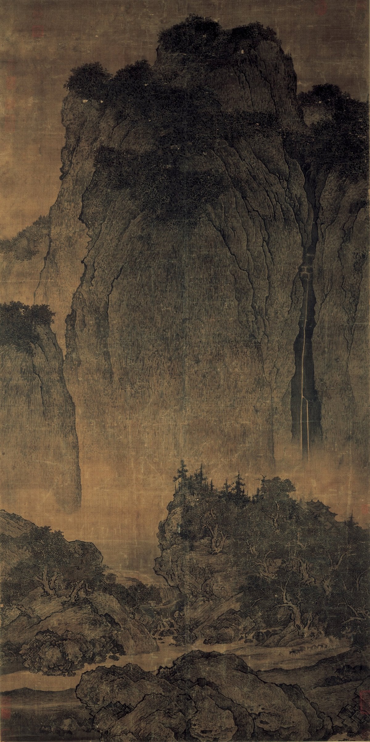 Fan Kuan, Travellers Among Mountains and Streams (c.1000), a monumental Northern Song hanging scroll in ink on silk: a towering central massif with a mule train dwarfed at its base. National Palace Museum, Taipei.
