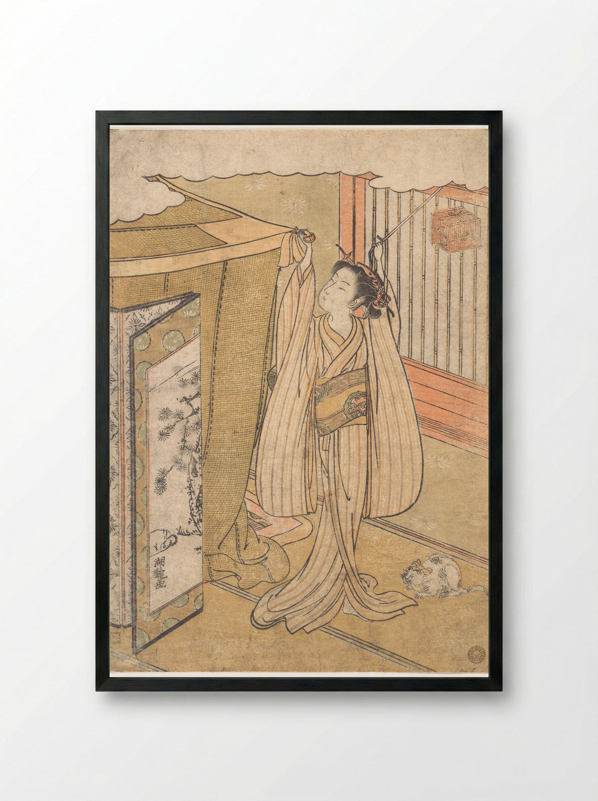 A Girl Hanging up a Mosquito Net Canopy over Her Bed - Isoda Koryūsai - Framed Print Black
