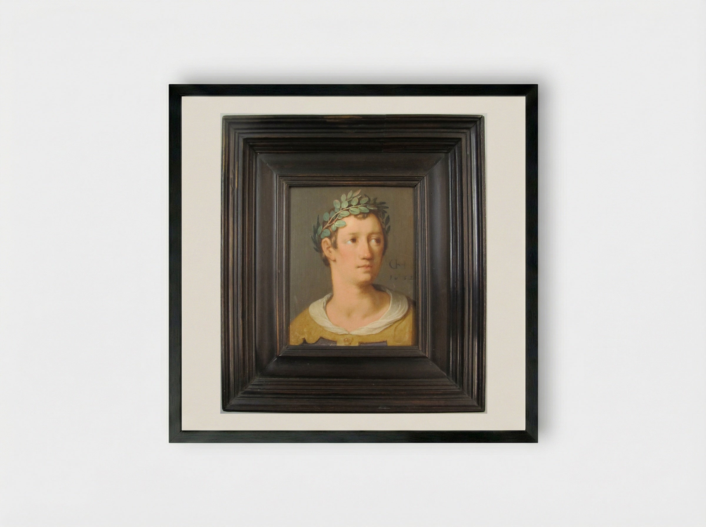 A Young Man with a Crown of Laurel Leaves - Cornelis Cornelisz. van Haarlem - Framed Print Black