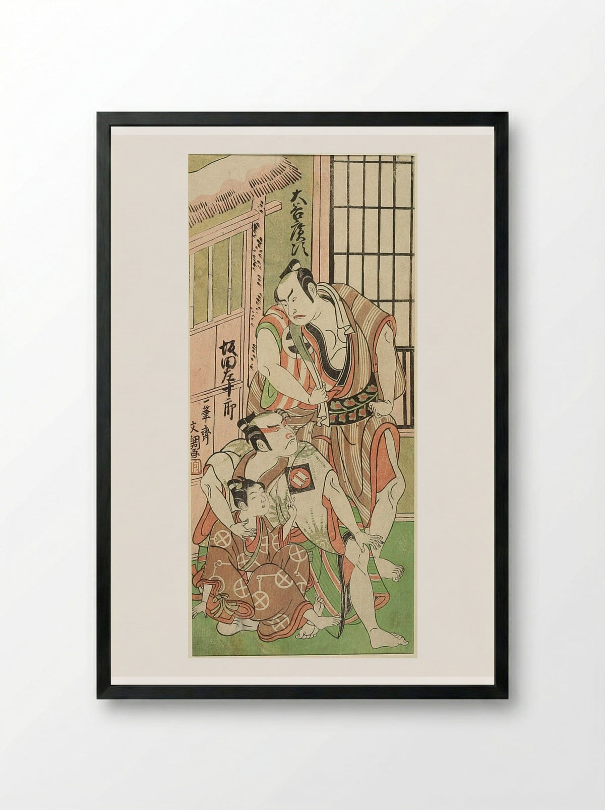 Actors Ōtani Hiroji III and Sakata Sajūrō as Wrestlers with a Boy - Ippitsusai Bunchō - Framed Print Black
