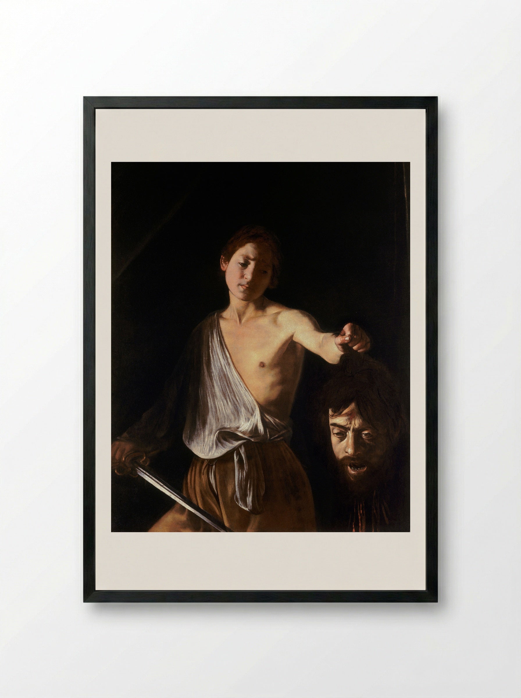 David with the Head of Goliath - Caravaggio - Framed Print Black
