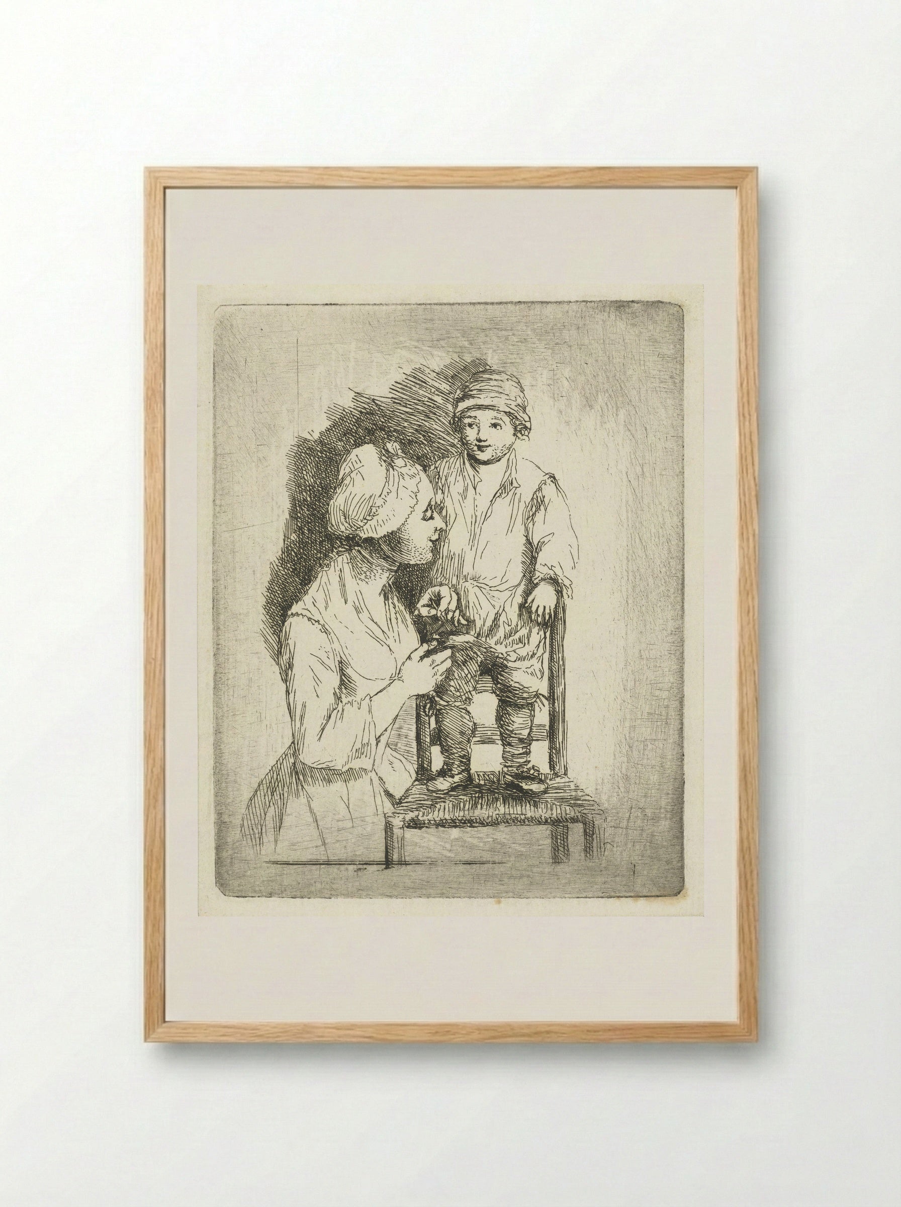 Een moeder zet een knoop aan de broek van haar zoon - Louis Bernard Coclers - Framed Print Wood