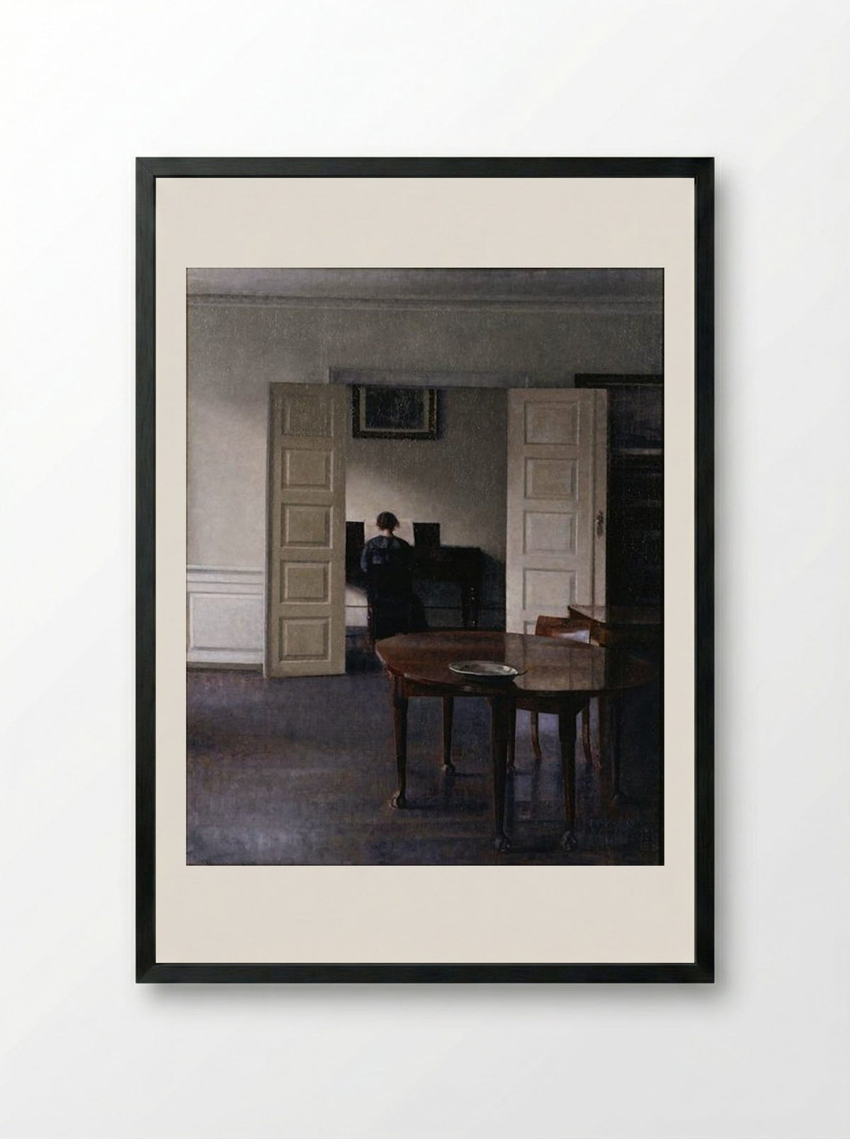Interior with Ida Playing the Piano - Vilhelm Hammershoi - Framed Print Black