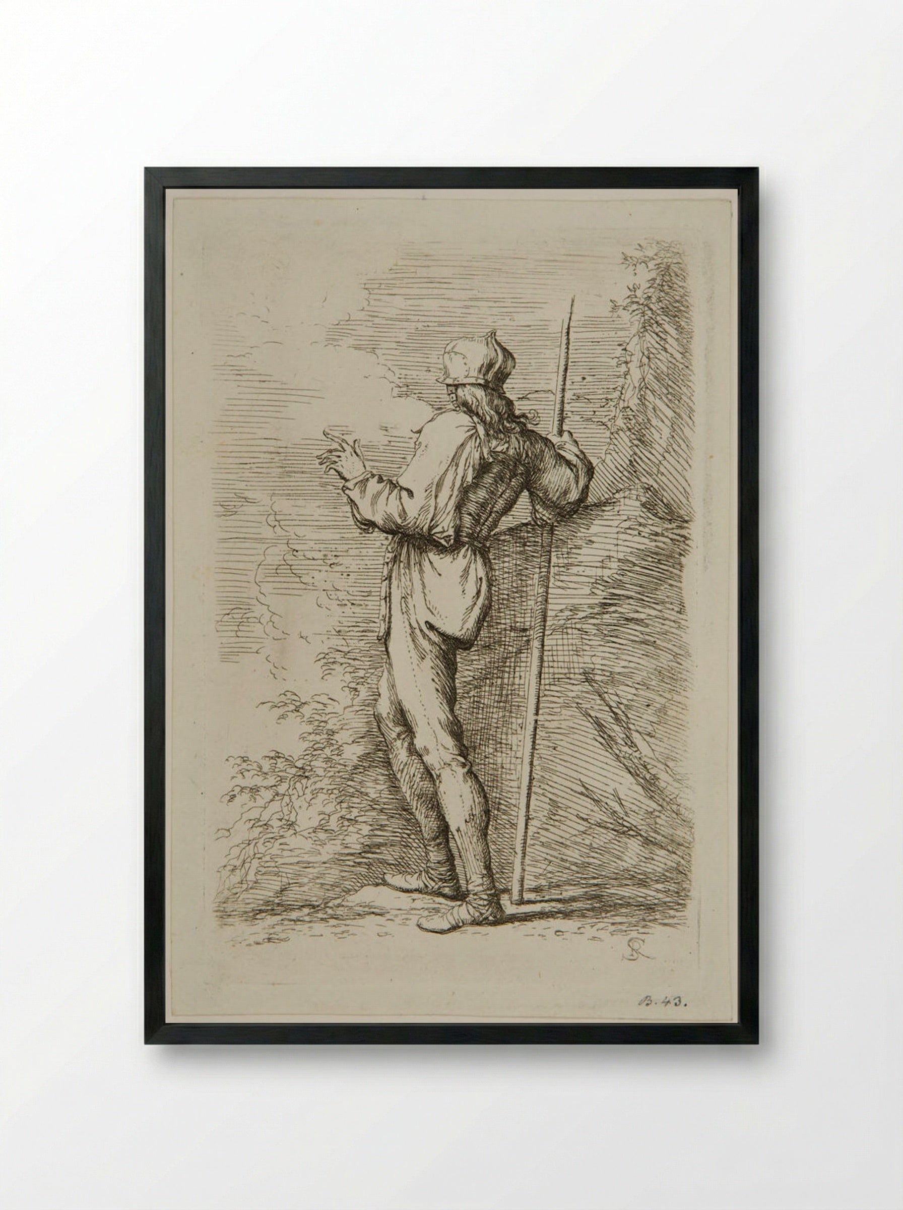 Soldier with a Staff Standing Next to a Large Rock - Salvator Rosa - Framed Print Black