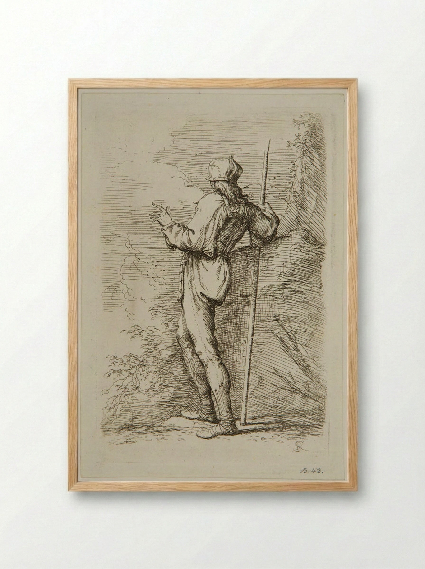 Soldier with a Staff Standing Next to a Large Rock - Salvator Rosa - Framed Print Wood