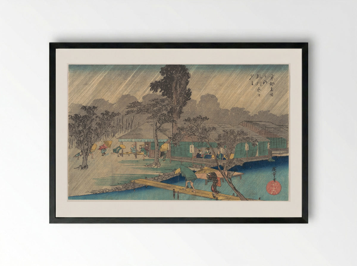 Tea-houses on the Bank of the Tadasu River in a Shower - Utagawa Hiroshige - Framed Print Black