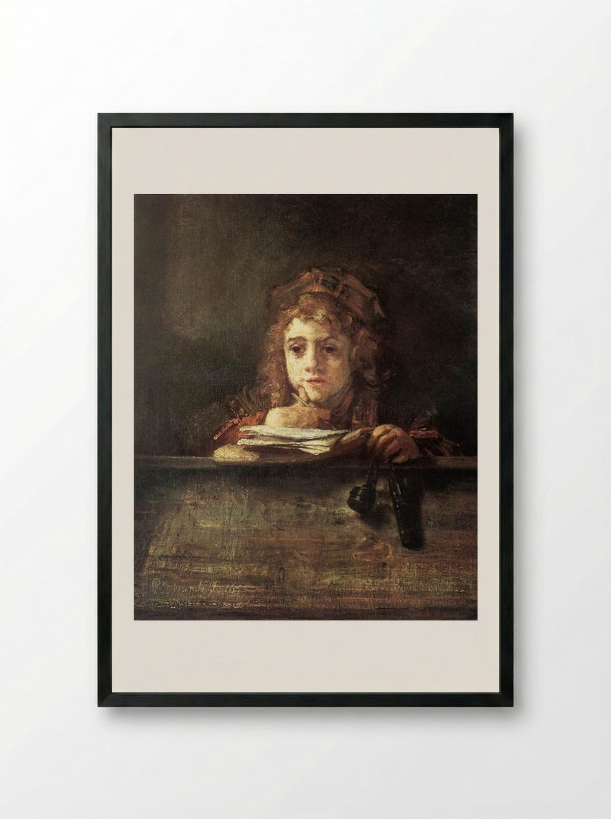 Titus at his Desk - Rembrandt van Rijn - Framed Print Black