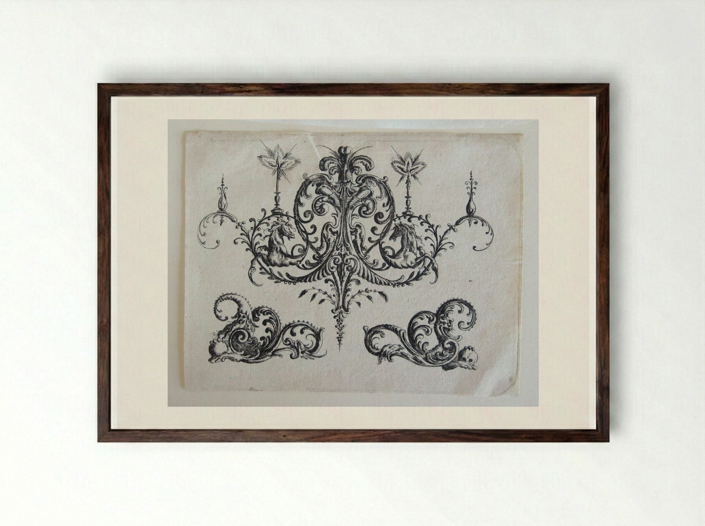 Tripartite Foliate Ornament, the Central Motif with a Helmet, Two Blazing Candles, and Tendrils Ending in Horses - Christoph Jamnitzer - Framed Print Dark Wood
