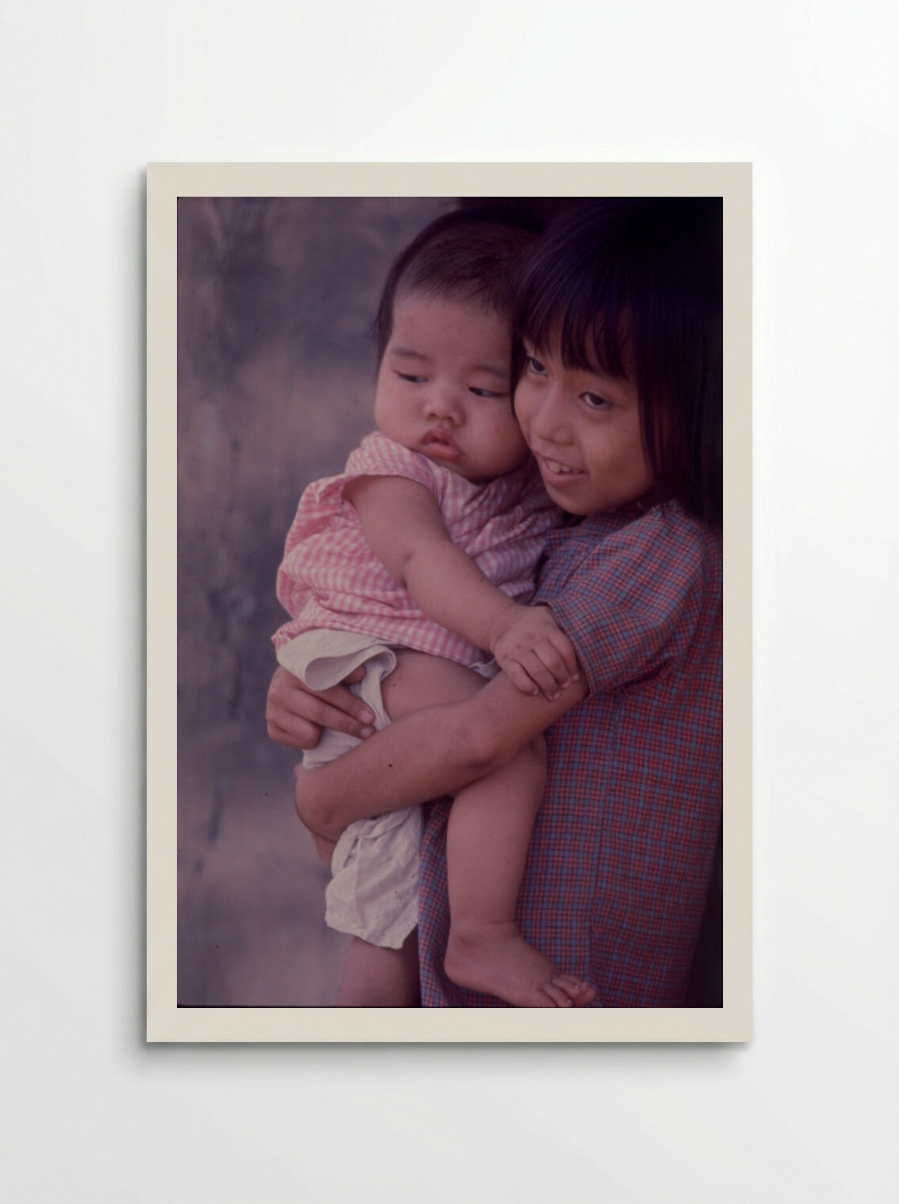 Untitled (Young Girl Holding Baby, Hue, Vietnam) - Gordon W. Gahan - Poster