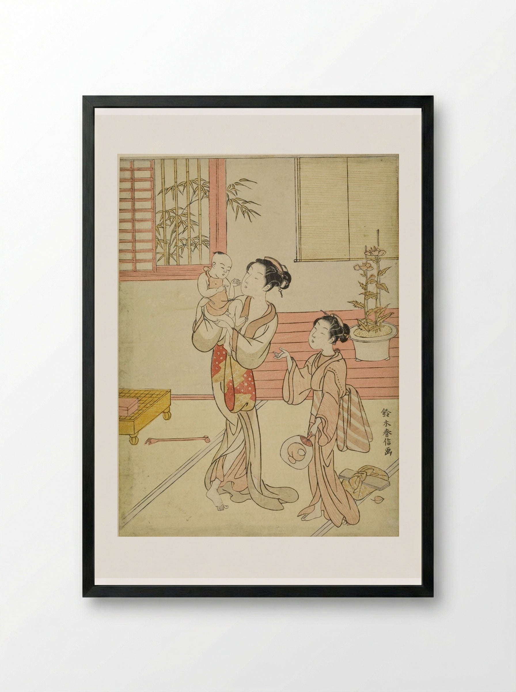 Woman and Girl Amusing a Baby - Suzuki Harunobu - Framed Print Black