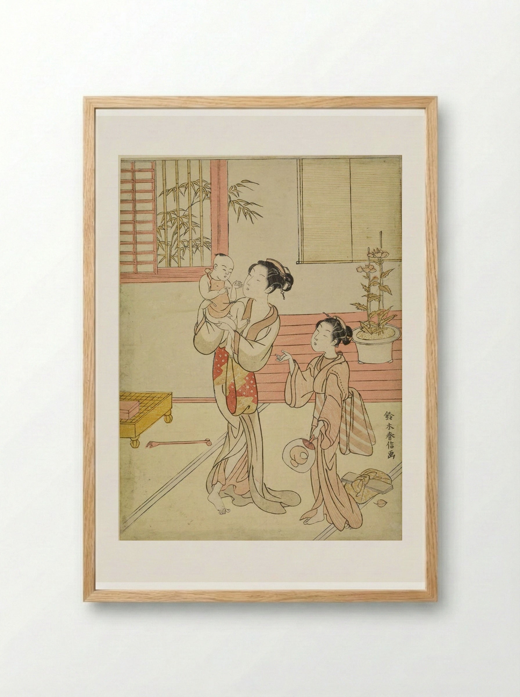 Woman and Girl Amusing a Baby - Suzuki Harunobu - Framed Print Wood