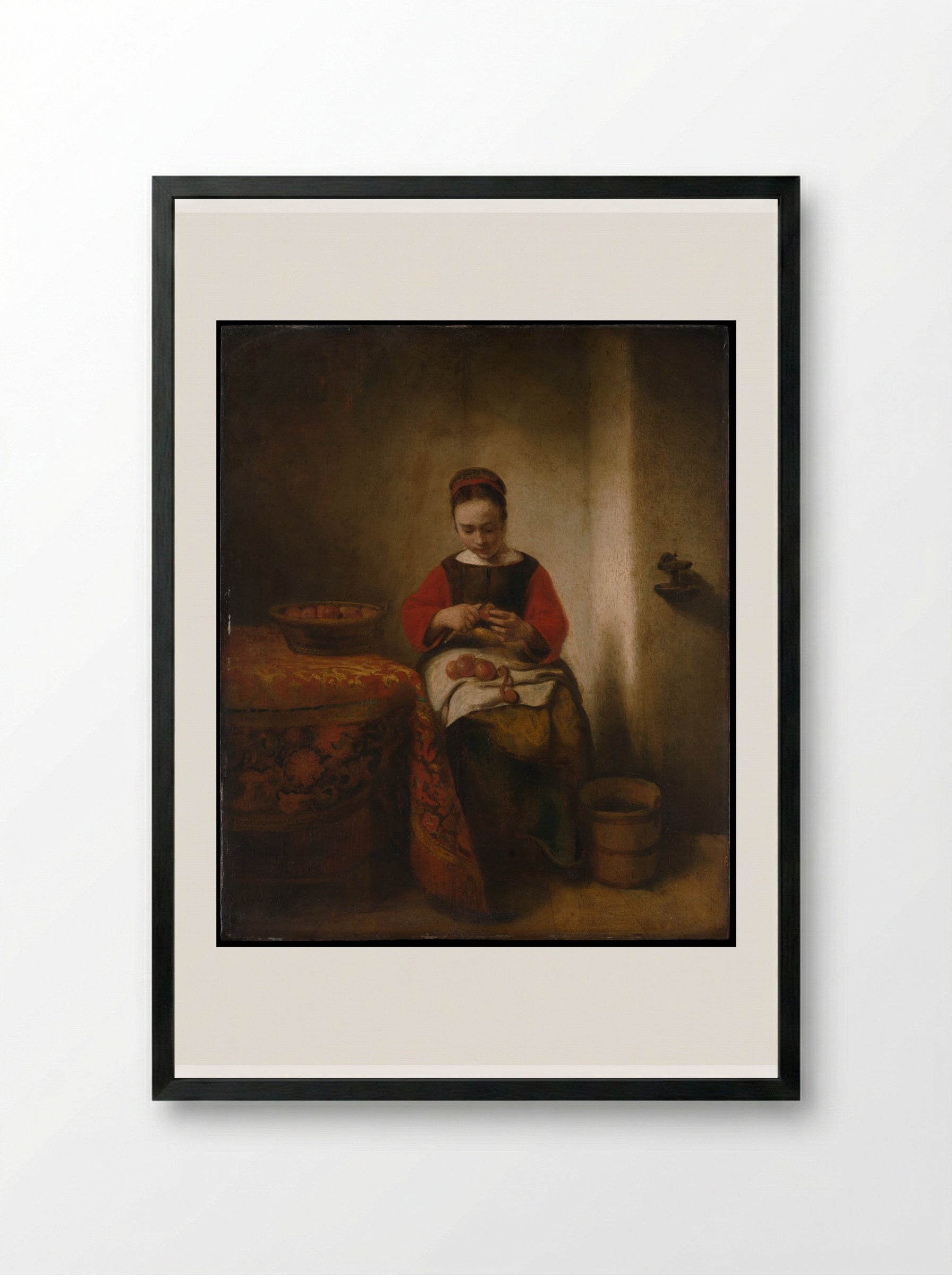 Young Woman Peeling Apples - Nicolaes Maes - Framed Print Black
