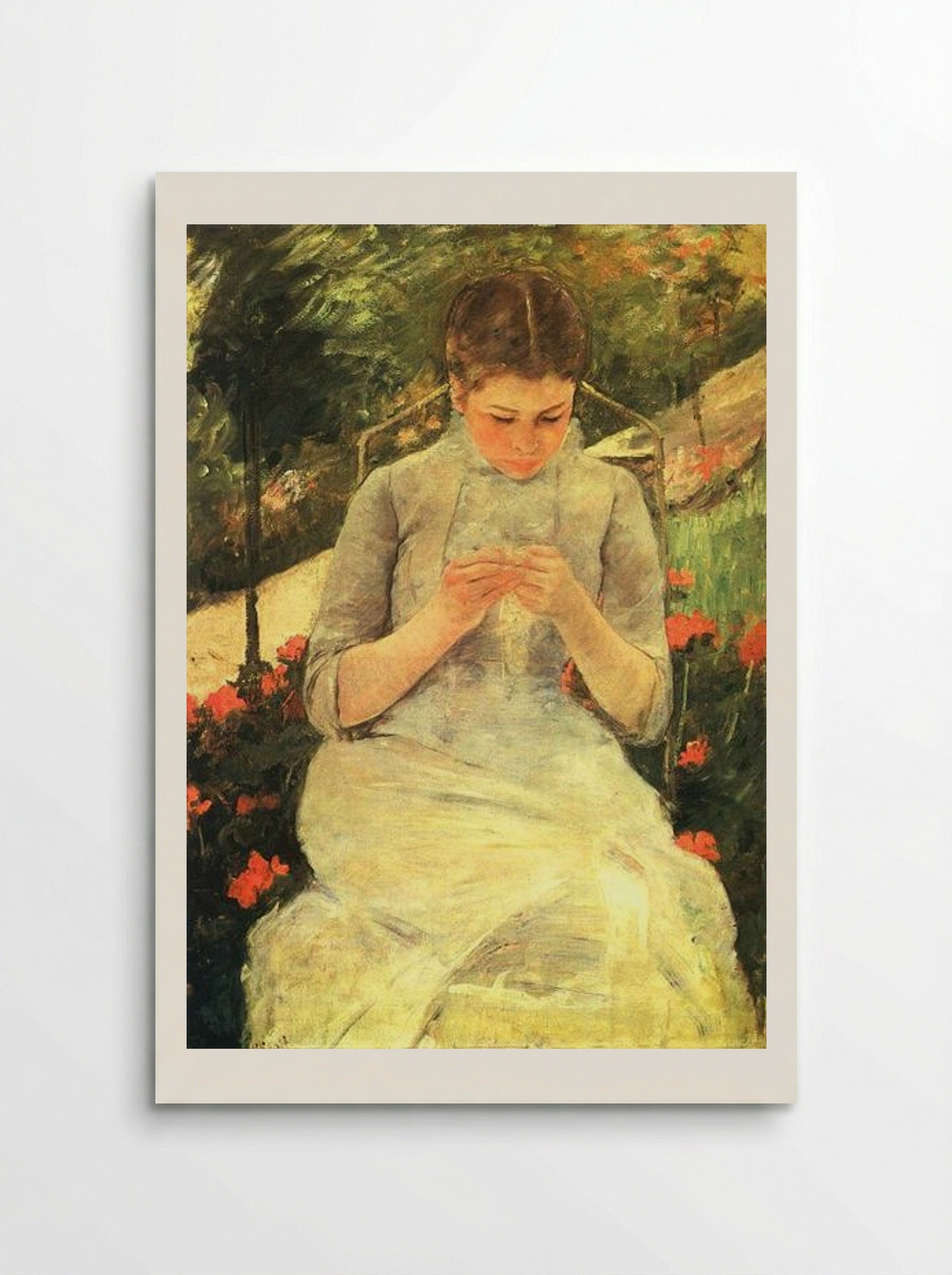Young Woman Sewing in the Garden - Mary Cassatt - Poster