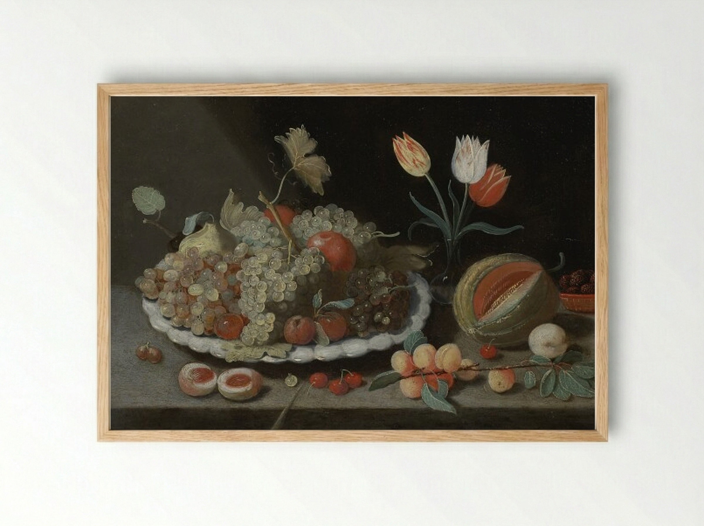 Still life with grapes and other fruit on a platter, a glass vase with tulips, a melon, apricots, cherries and other fruit, all on a ledge - Jan van Kessel the Elder - Framed Print Wood