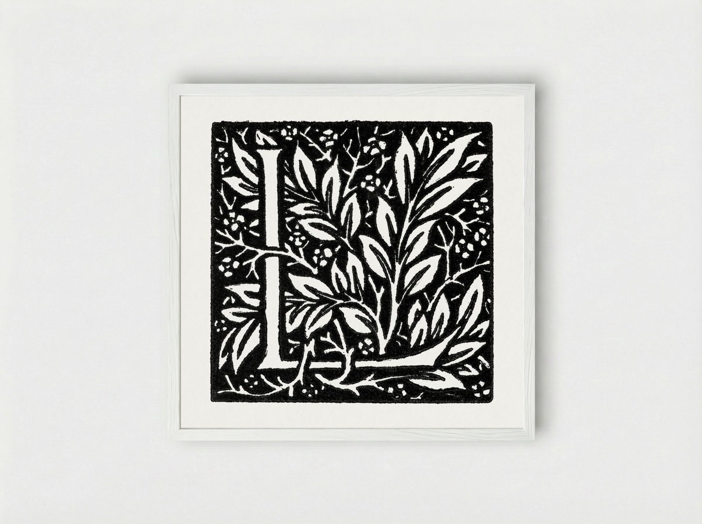 Love is Enough: Initial Letter 'L' entwined with Laurel Leaves - William Morris - Framed Print White