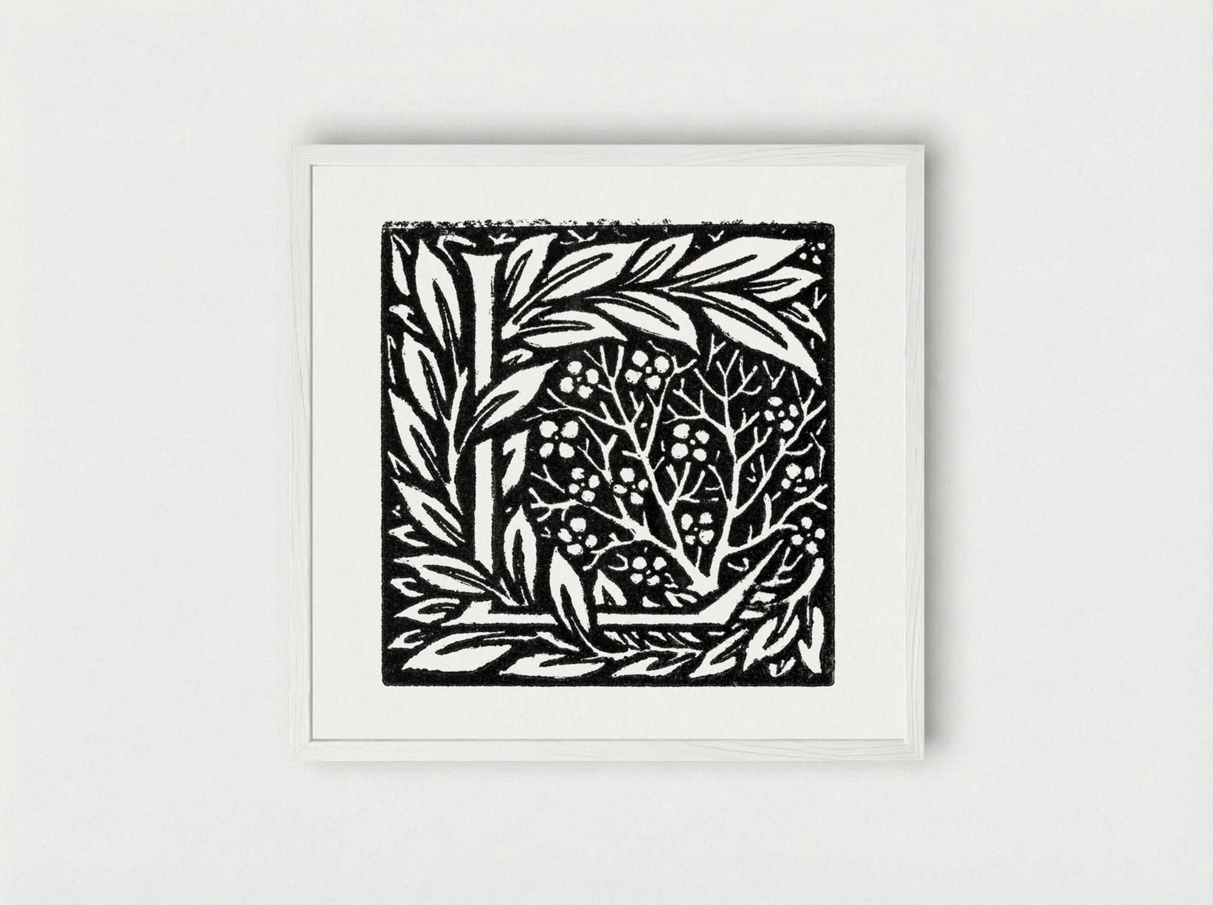 Love is Enough - Initial letter 'L' entwined with Laurel Leaves - William Morris - Framed Print White